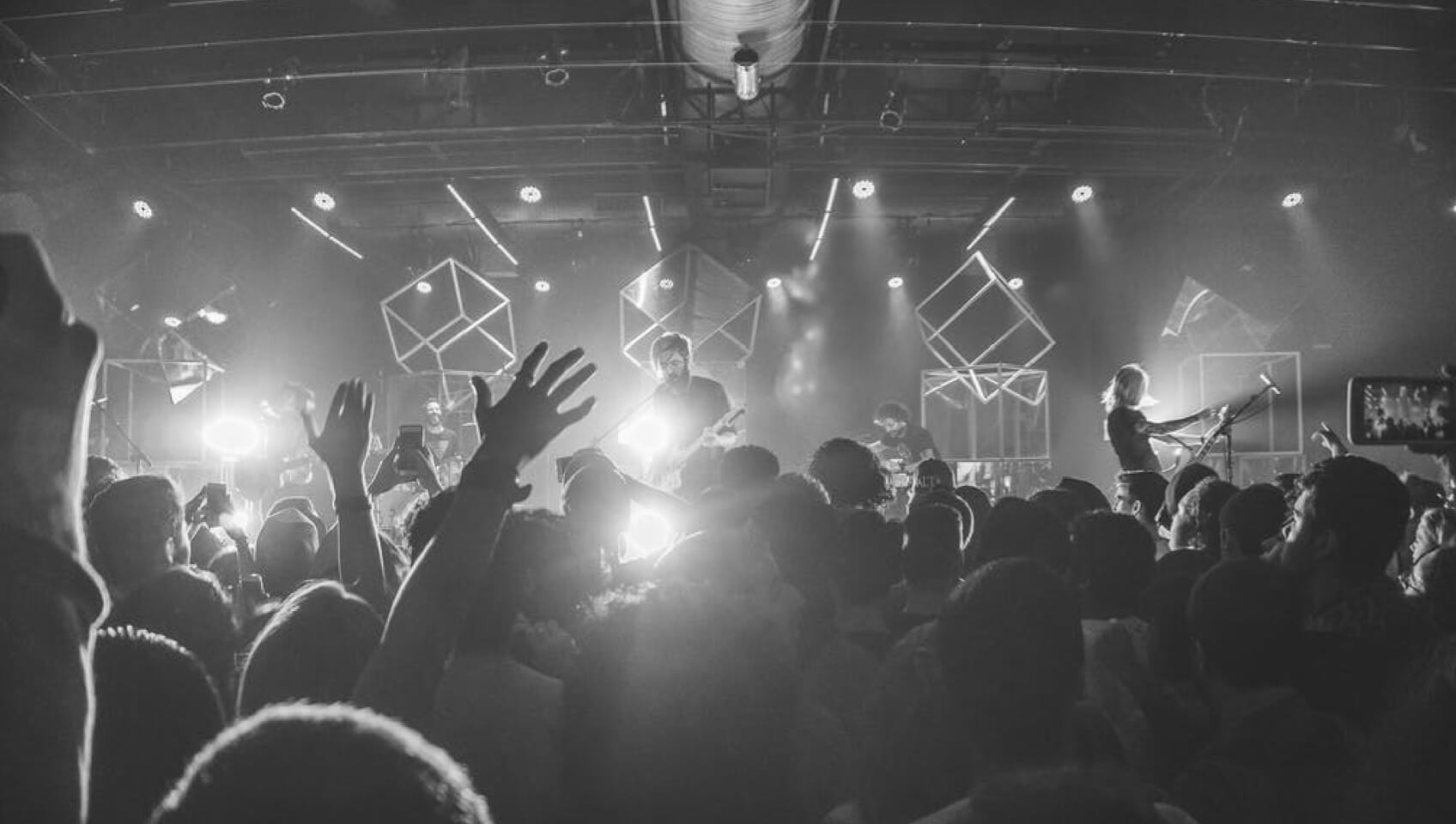 Photo of a band playing to a crowd