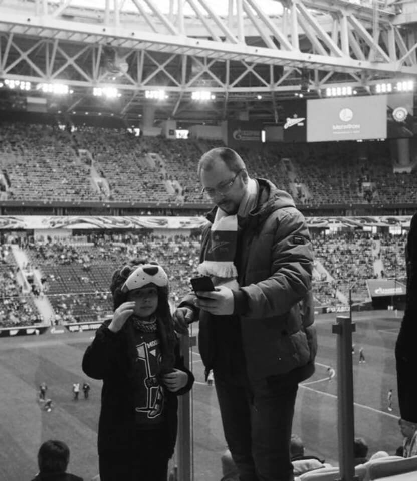 Photo of a man and boy in a stadium